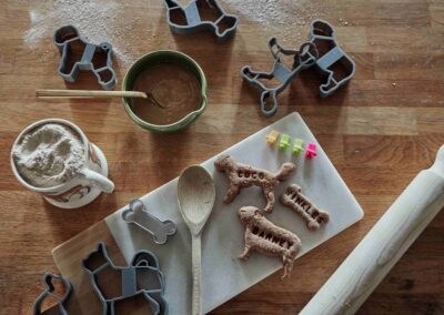 Dog-shaped biscuit cutters and homemade treats being prepared at the Country Dog Hotel